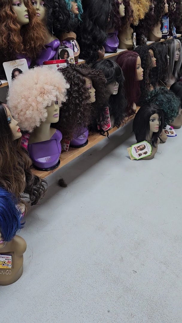 Store aisle lined with hair bundles and lashes.